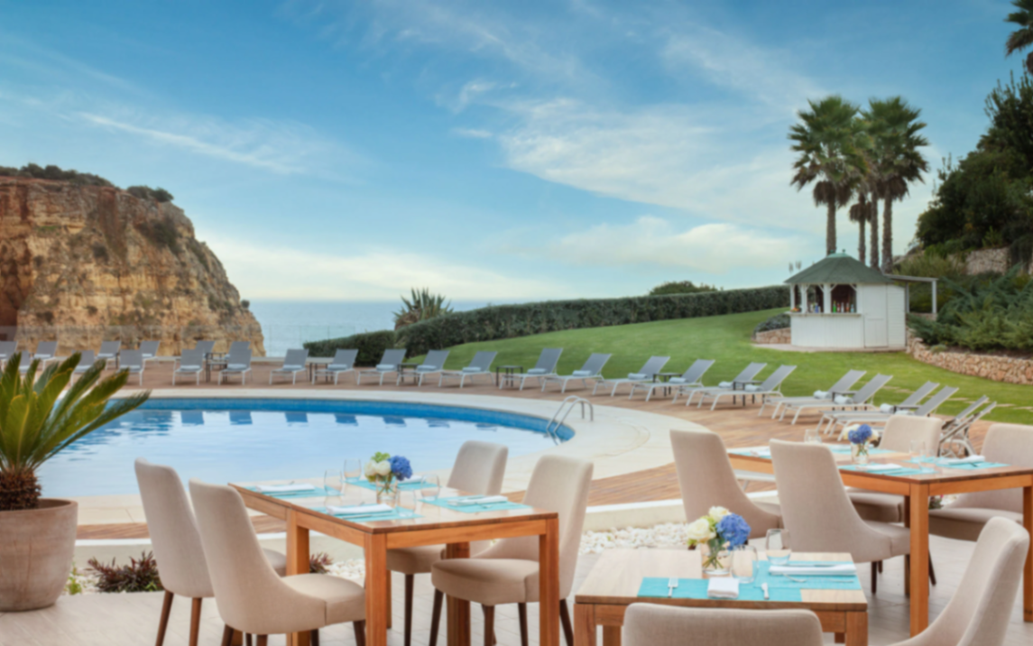 Luxury resort pool terrace by the ocean cliffs in Portugal